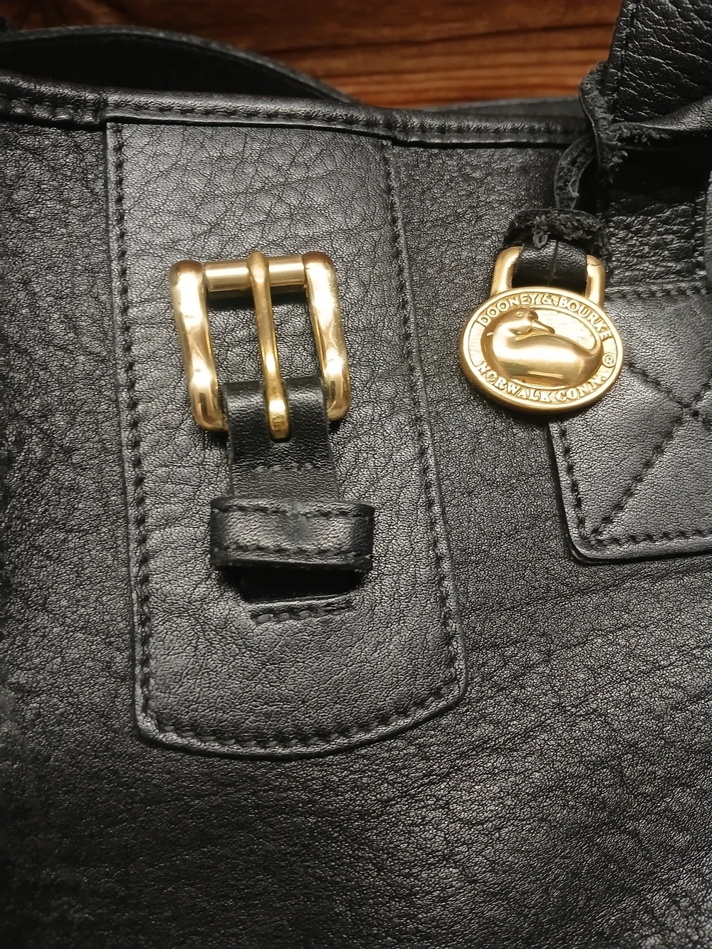 Dooney & Bourke Black Leather Tote with Gold Charm